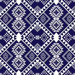 seamless geometric ethnic pattern on navy blue background.