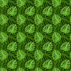Lush green leaves create a tropical pattern design