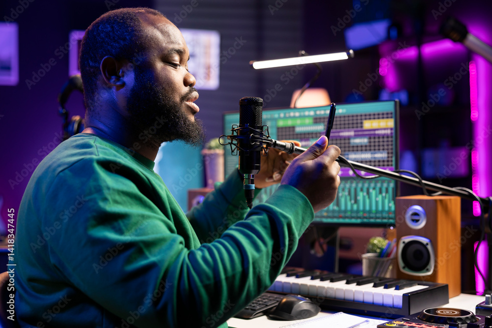 Poster artist songwriter performing his new musical creation in home studio, recording a new song for the a