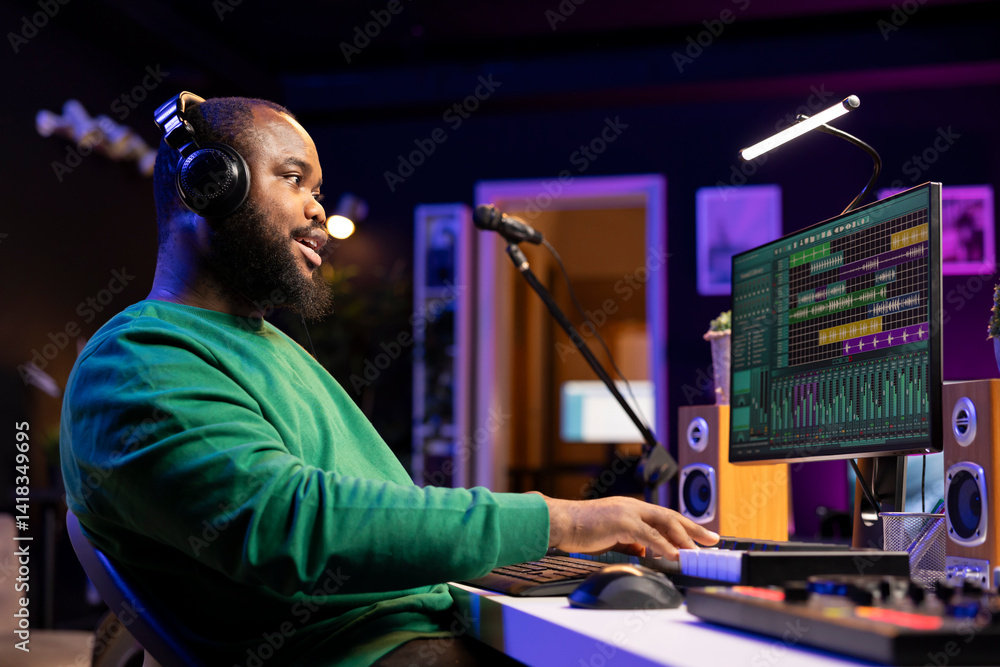 Aufkleber artist playing electronic piano keyboard to record sounds and use mixing techniques, editing recordi