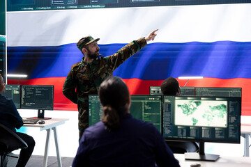 Russian federation soldier installing panic with fake news and propaganda during hybrid war tactics, hacking activity. Military hackers stealing state secrets, digital mercenaries.