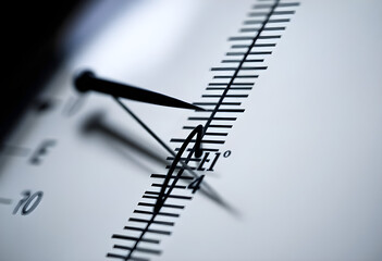 Fototapeta premium close up of a clock with a pen on it