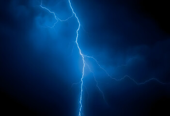 lightning bolt hitting through a dark blue sky