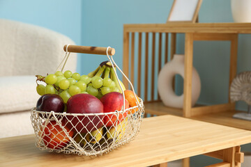 Fruit basket on coffee table in living room, closeup