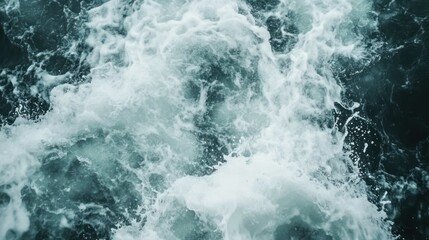 Turbulent sea with foamy waves; a dynamic display of water in motion.