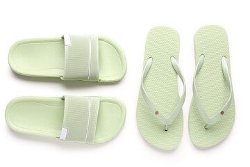 Colorful pairs of female flip flops on white background