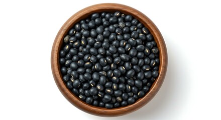 Black gram in wooden bowl isolated on white background. Mexican food