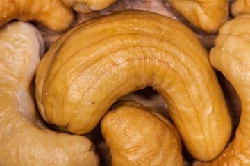 Cashew nuts. Handful of roasted cashew nuts on a white background.