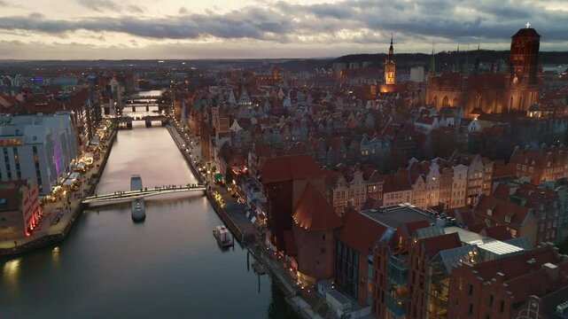 aerial flyover of gdansk city center at sunset in winter