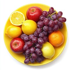 Assortment of fresh fruits arranged on a vibrant yellow plate isolated on white background