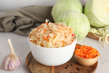 Composition with tasty sauerkraut and ingredients on table. Closeup