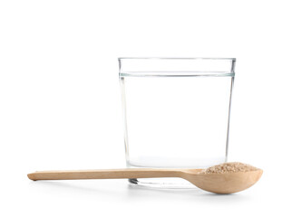 Glass of water with psyllium husk powder on white background