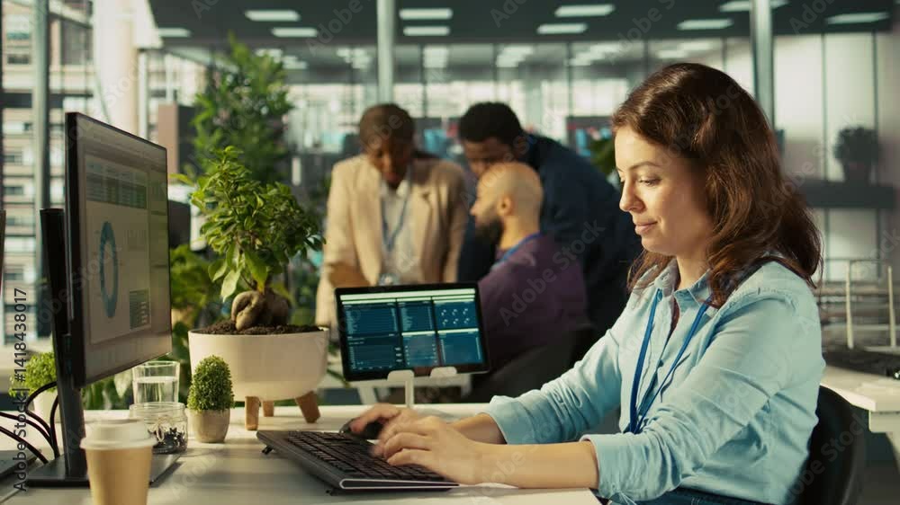 Poster employee at office desk typing on keyboard, editing documents on computer. worker inputting data on 