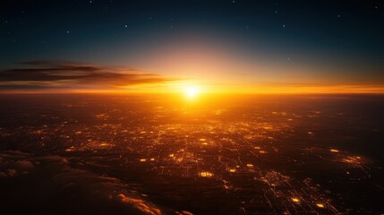 Sunrise over a sprawling cityscape illuminating streets and buildings in golden light from an aerial perspective