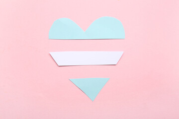 Transgender flag in shape of heart on pink background