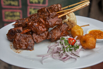 Lima-style anticuchos come to life—marinated with tradition, grilled with heart. A street food classic that captures the soul of Peruvian flavor.