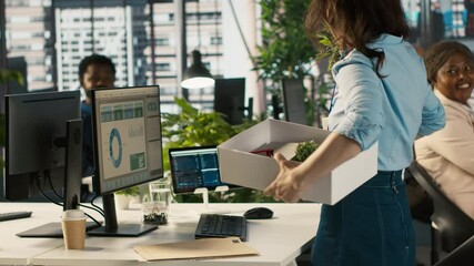 Happy employee starting first day at new job, unpacking belongings, meeting coworkers. Cheerful worker arriving in office, starting work on new company position, being welcomed by team, camera A