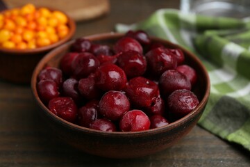 Tasty cherries and other fruits on wooden table, closeup