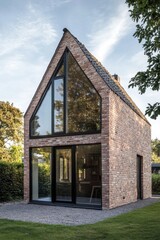 Obraz premium Modern brick house with large glass windows situated in a peaceful garden during late afternoon with sunlight illuminating the exterior walls