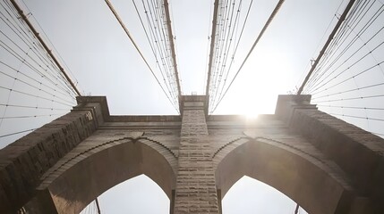 Fototapeta premium Perspective View of Iconic Bridge with Dramatic Sky Lighting