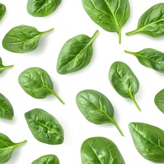Obraz premium Fresh Green Spinach Leaves on White Background for Healthy Cooking