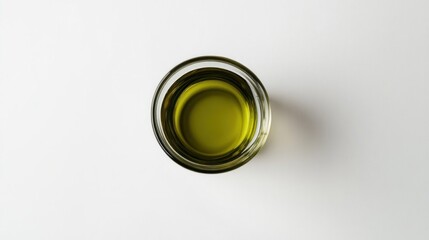 Transparent glass bowl filled with yellow-green liquid.