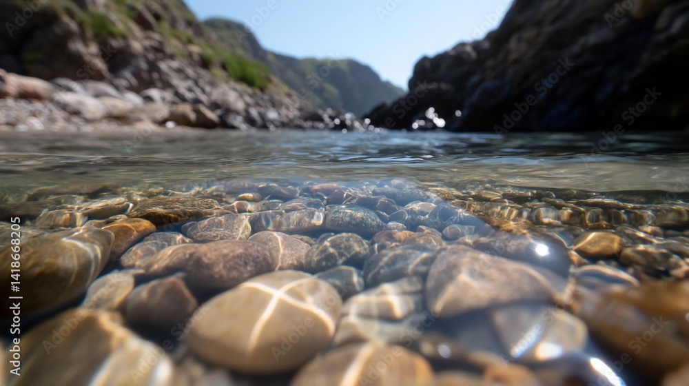 Poster clear water flowing over smooth river rocks with sun reflections and mountain backdrop creating a se