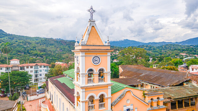 Historic Clock Tower in Villeta, Cundinamarca, Colombia Surrounded by Lush Green Mountains