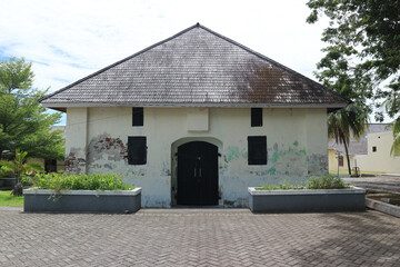 An old warehouse building with an ancient architectural style. Suitable for use as a background for ancient or horror themes  © Hary TS