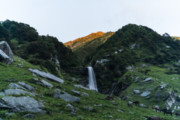 Pristine waterfall in monsoon season in the Himalayas mountain during a trek in Himachal Pradesh,...
