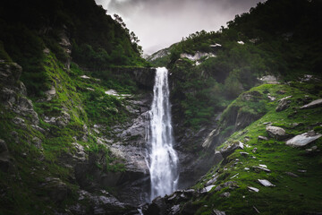 Fototapeta premium Pristine waterfall in monsoon season in the Himalayas mountain during a trek in Himachal Pradesh, india 