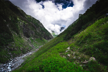 Beautiful landscape shot of a gorgeous Himalayan mountain valley with dense forests during monsoon...