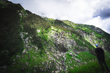 Beautiful landscape shot of a gorgeous Himalayan mountain valley with dense forests during monsoon...