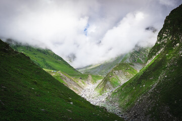 Beautiful landscape shot of a gorgeous Himalayan mountain valley with dense forests during monsoon...