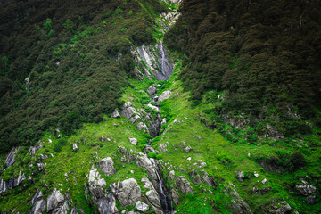 Beautiful landscape shot of a gorgeous Himalayan mountain valley with dense forests during monsoon...
