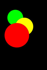 Abstract colorful circles in black space. Vector light effects.