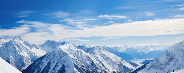 Obraz premium Majestic Snowy Mountain Range with Blue Sky