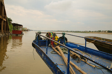 Fishing boat on calm river local waterway nautical scene tranquil environment riverbank view...
