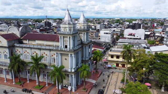 Aerial Majesty of Quibd&oacute;: River, Faith, and Rainforest. Drone views of Quibd&oacute;, Choco, Colombia, featuring the Atrato River, boats, rainforest, and the iconic cathedral. A vibrant mix of nature.