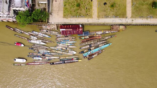 Aerial Majesty of Quibd&oacute;: River, Faith, and Rainforest. Drone views of Quibd&oacute;, Choco, Colombia, featuring the Atrato River, boats, rainforest, and the iconic cathedral. A vibrant mix of nature.