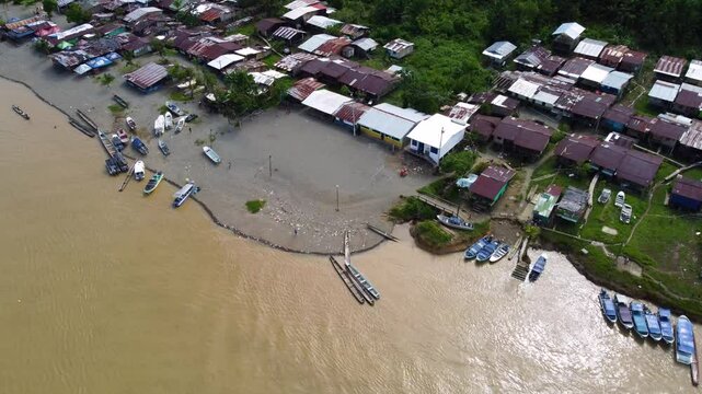 Aerial Majesty of Quibd&oacute;: River, Faith, and Rainforest. Drone views of Quibd&oacute;, Choco, Colombia, featuring the Atrato River, boats, rainforest, and the iconic cathedral. A vibrant mix of nature.