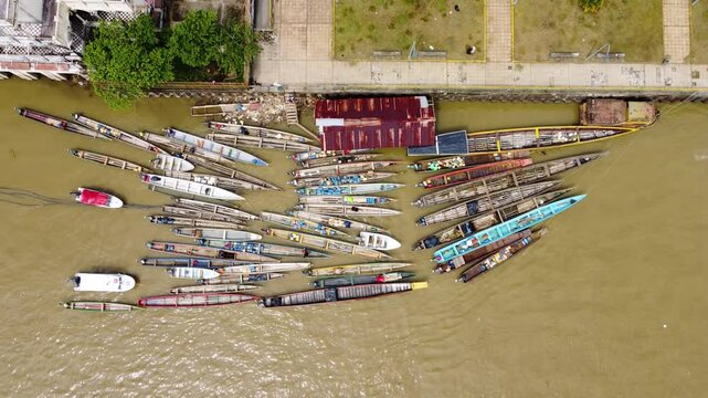 Aerial Majesty of Quibd&oacute;: River, Faith, and Rainforest. Drone views of Quibd&oacute;, Choco, Colombia, featuring the Atrato River, boats, rainforest, and the iconic cathedral. A vibrant mix of nature.