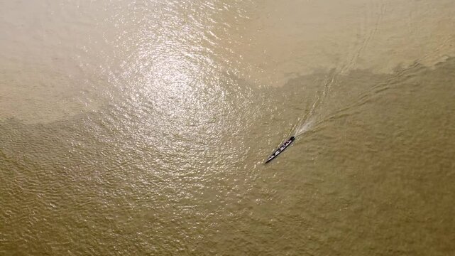 Aerial Majesty of Quibd&oacute;: River, Faith, and Rainforest. Drone views of Quibd&oacute;, Choco, Colombia, featuring the Atrato River, boats, rainforest, and the iconic cathedral. A vibrant mix of nature.