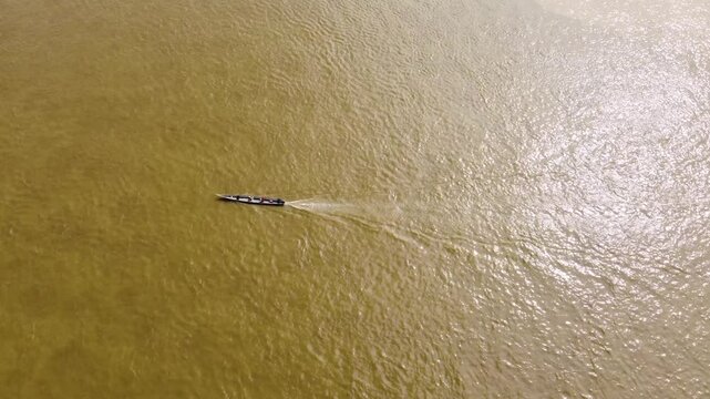 Aerial Majesty of Quibd&oacute;: River, Faith, and Rainforest. Drone views of Quibd&oacute;, Choco, Colombia, featuring the Atrato River, boats, rainforest, and the iconic cathedral. A vibrant mix of nature.