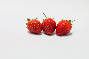 Fresh strawberries isolated background food photography studio setting close-up view healthy snack inspiration
