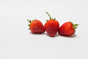 Fresh strawberries on white background food photography natural light close-up view delicious healthy snack
