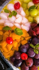 Exotic Mixed Fruits Platter with Mangoes, Lychees, Grapes, Strawberries and Cherries for a Refreshing Tropical Treat