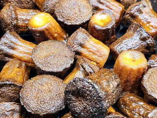 Close up Mini Caneles. It is a small French pastry originating from Bordeaux.