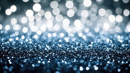 Fototapeta premium A shimmering display of blue glitter and bokeh lights.