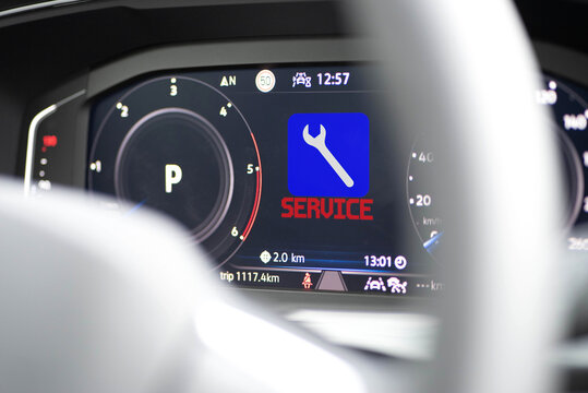 Dashboard of a modern car and symbol for service